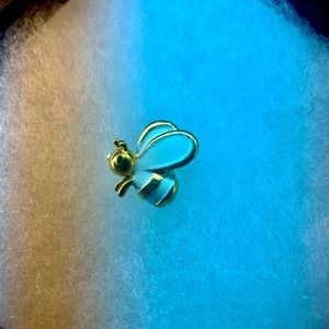 Vintage Tricari brooch. White and gold stamped.